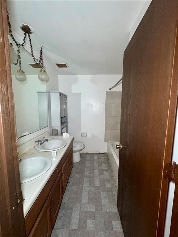7305 Bennett Street Pittsburgh, PA 15208 - Photo 7 of 12 a spacious bathroom with a granite countertop sink a mirror and a bathtub