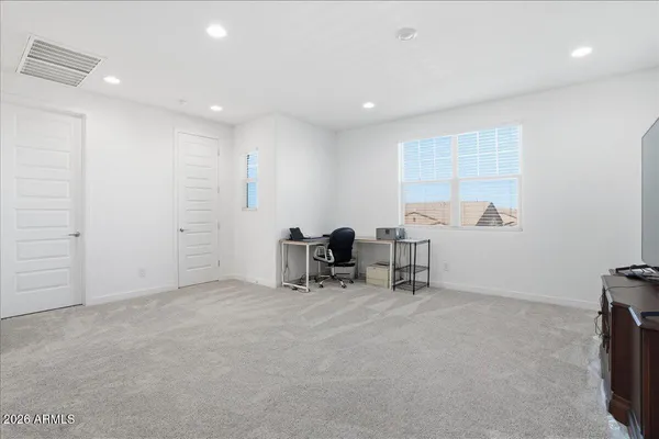 a view of a workspace with furniture
