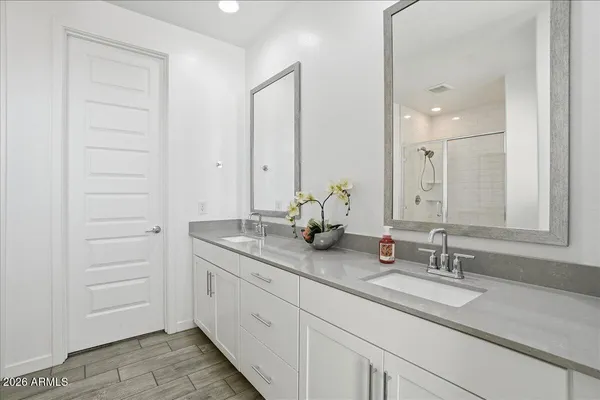a bathroom with a shower and a glass door