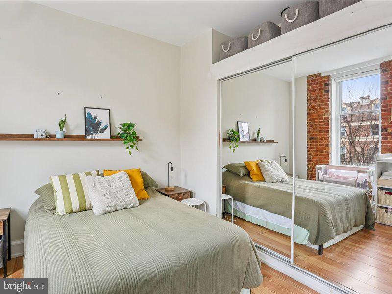 1615 Q Street Northwest, Unit 201 Washington, DC 20009 - Photo 16 of 20 a bedroom with bed and a window