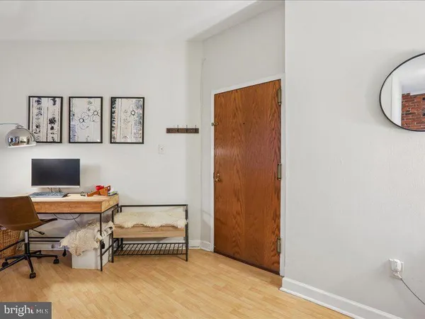a workspace with furniture and a window