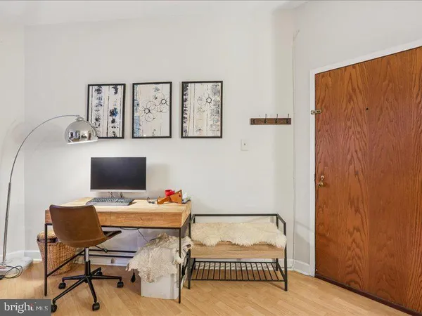 a bedroom with a workspace