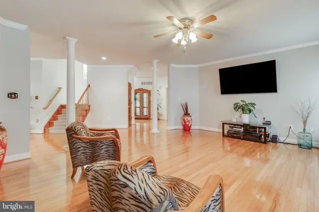 a kitchen with stainless steel appliances granite countertop a refrigerator a oven a stove and a sink