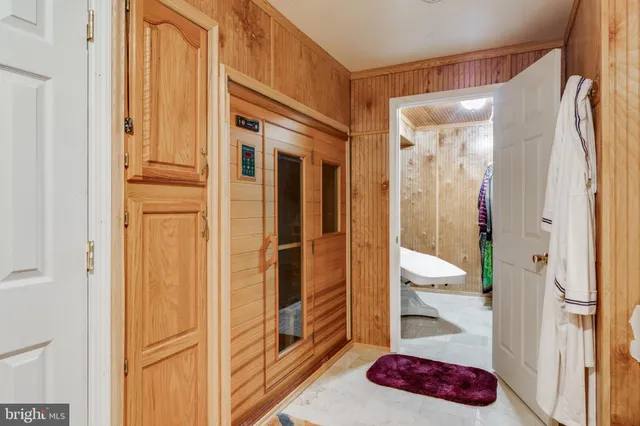 a view of balcony with wooden floor and outdoor seating
