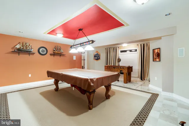 an aerial view of a house with yard swimming pool and outdoor seating