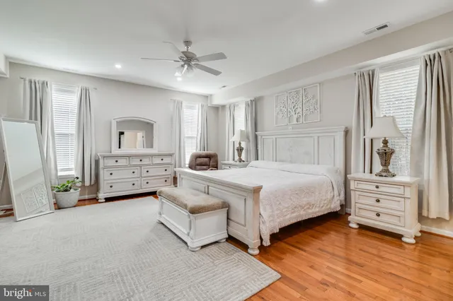 a bedroom with a bed and a chair