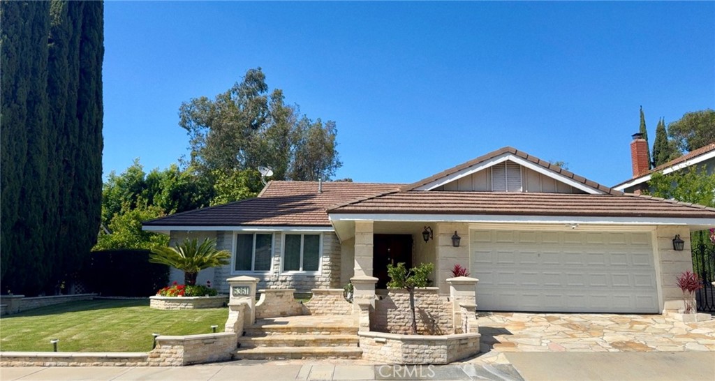 5361 Rural Ridge Circle Anaheim Hills, CA 92807 - Photo 1 of 128 a front view of a house with garden