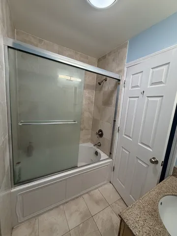 a bathroom with a shower and a toilet