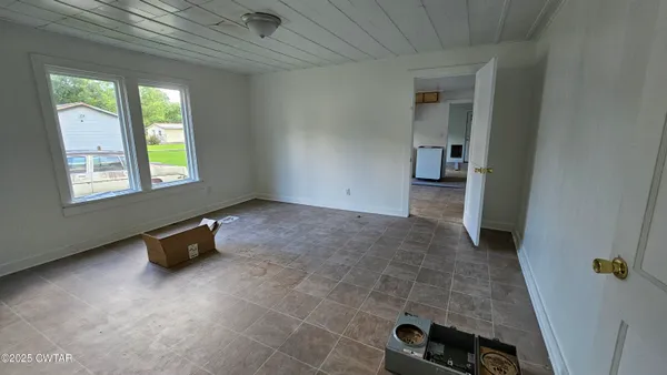 an empty room with windows