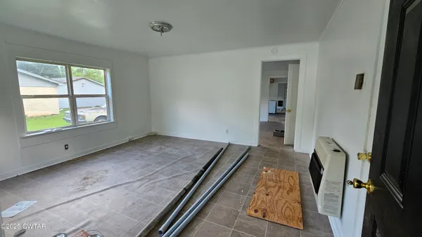 a view of an empty room and window