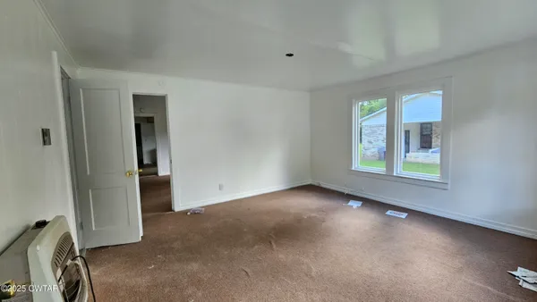 an empty room with windows