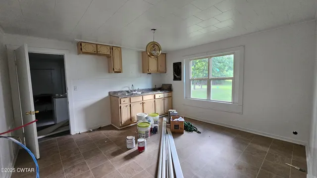 a bed room with a bed and a window