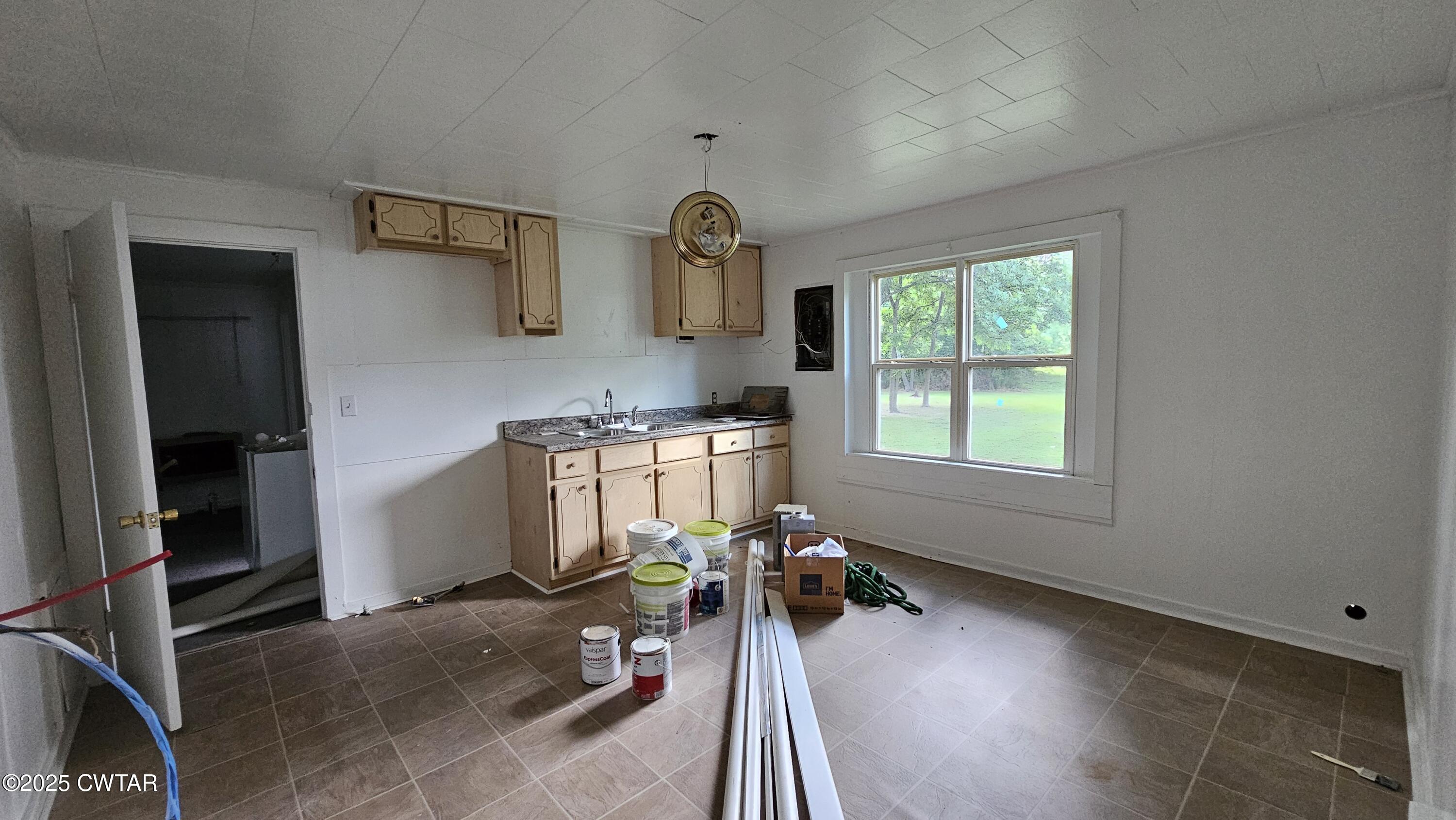 208-210 Lee Street Dyer, TN 38330 - Photo 9 of 13 a bed room with a bed and a window