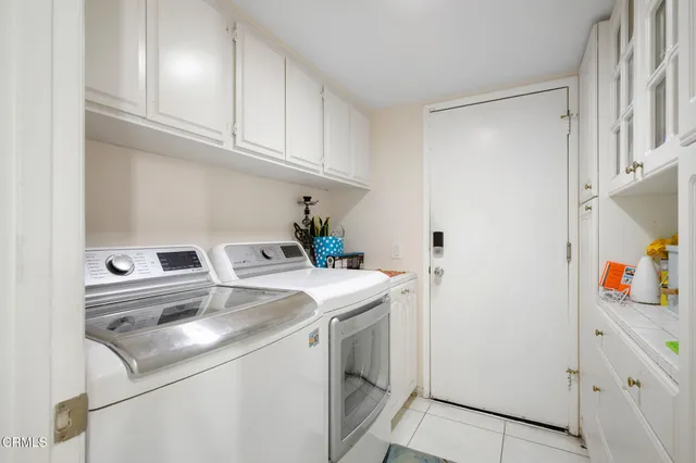 a view of a hallway with wooden floor and stairs
