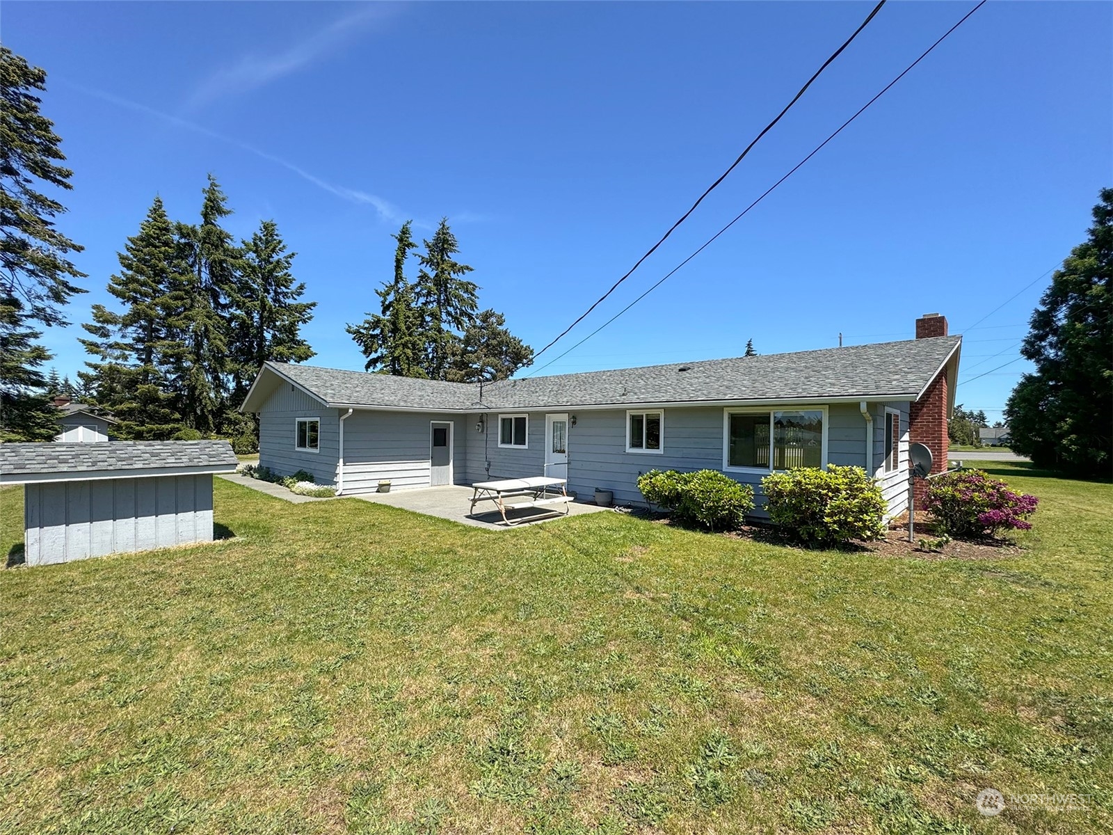 8944 Old Olympic Highway Sequim, WA 98382 - Photo 3 of 40 a view of a house with a yard and sitting area