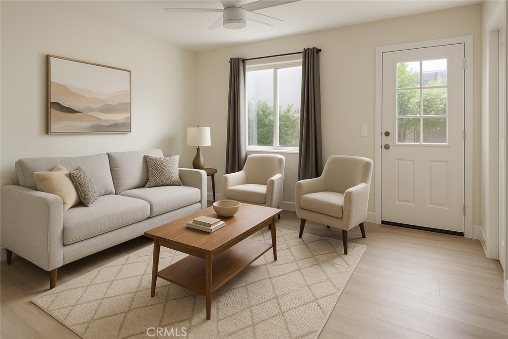 905 West Sumner Avenue, Unit B Lake Elsinore, CA 92530 - Photo 2 of 15 a living room with furniture and a window