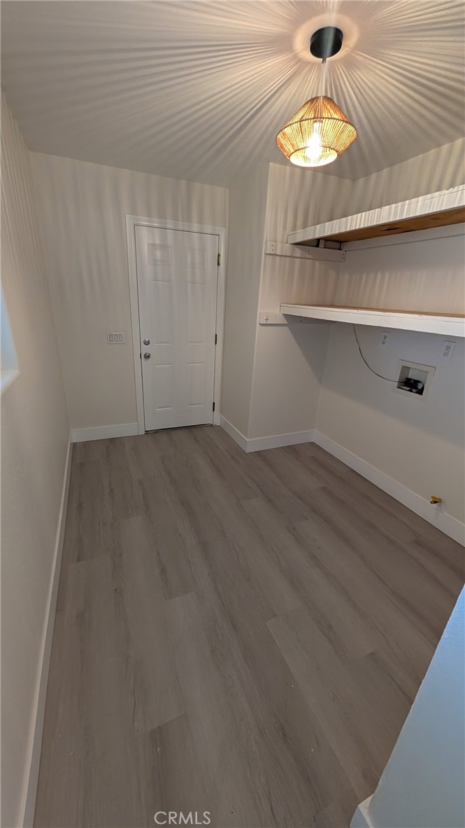 905 West Sumner Avenue, Unit B Lake Elsinore, CA 92530 - Photo 3 of 15 a view of room with a wooden floor