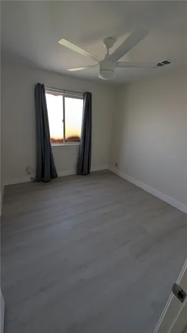wooden floor and window in an empty room