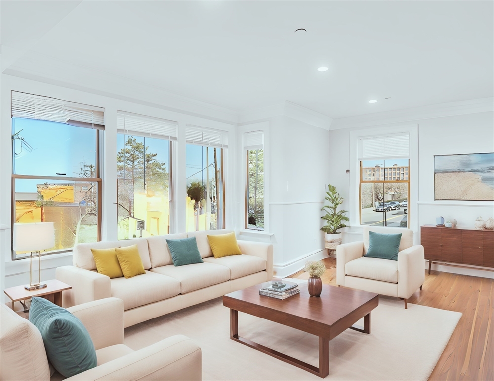 56 Belmont Street, Unit 1 Boston, MA 02129 - Photo 6 of 27 a living room with furniture and a large window