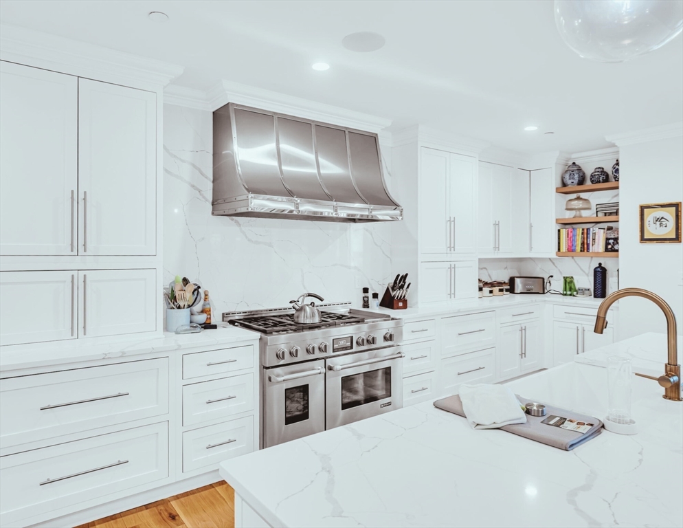 56 Belmont Street, Unit 1 Boston, MA 02129 - Photo 7 of 27 a kitchen with cabinets appliances and a sink