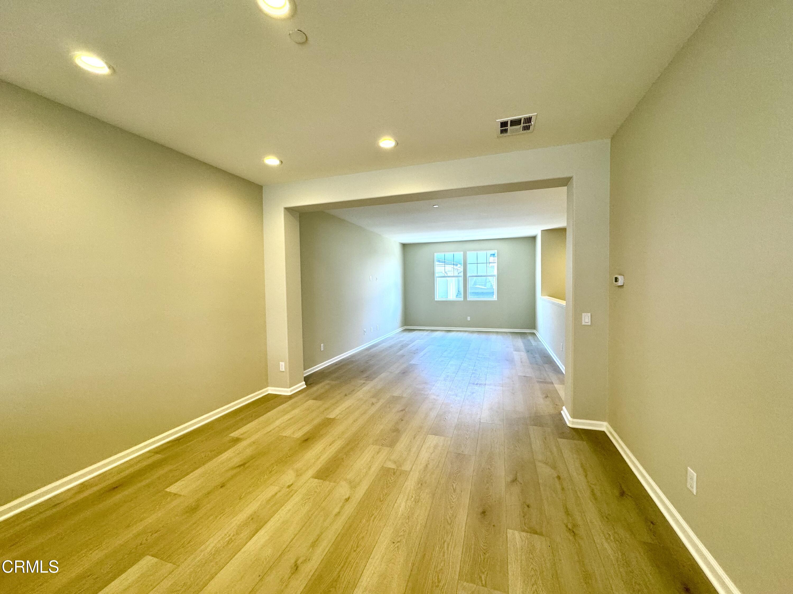 3667 Islander Walk Oxnard, CA 93035 - Photo 16 of 33 a view of a room with wooden floor and staircase