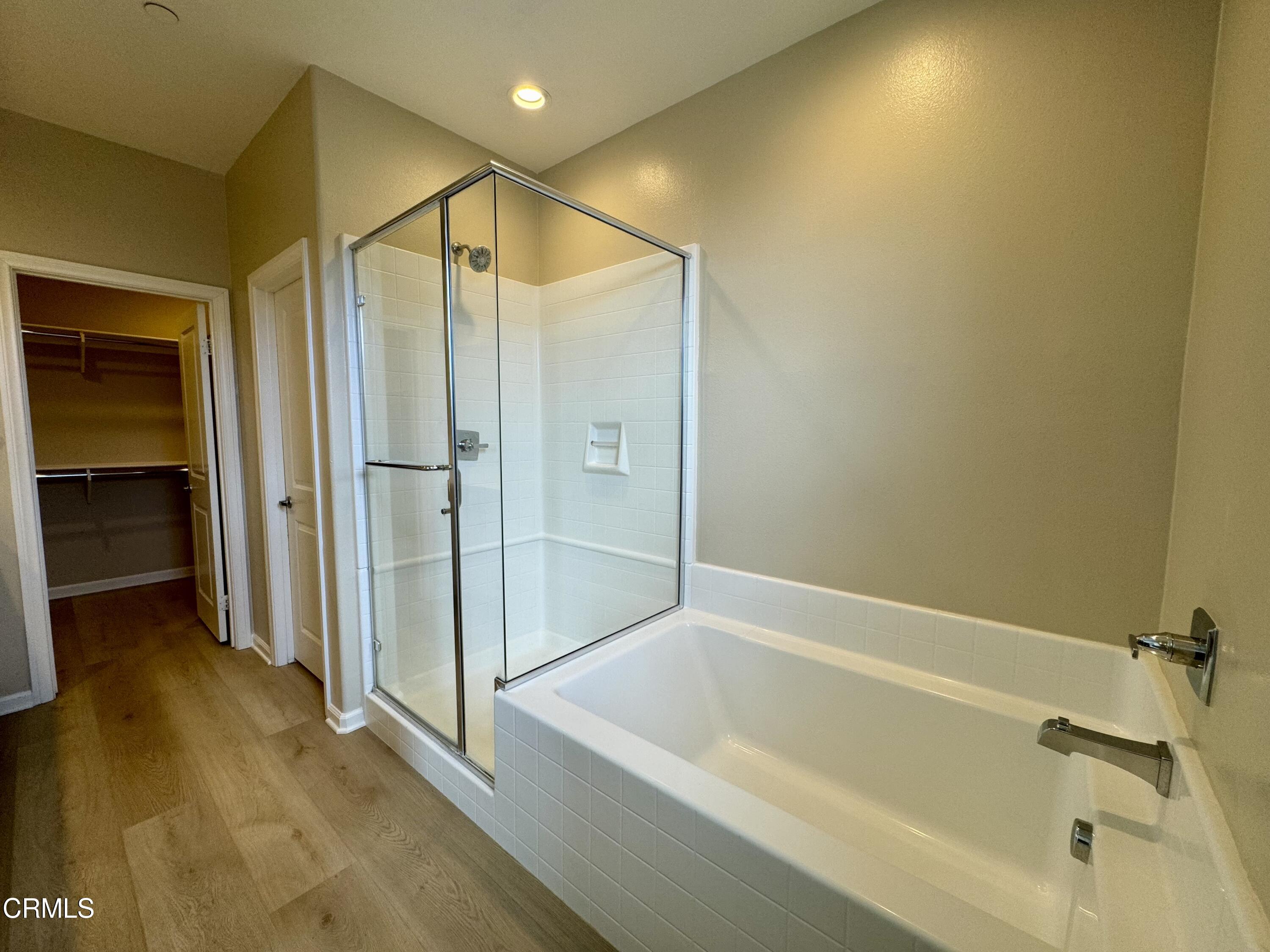 3667 Islander Walk Oxnard, CA 93035 - Photo 21 of 33 a bathroom with a bathtub and a shower
