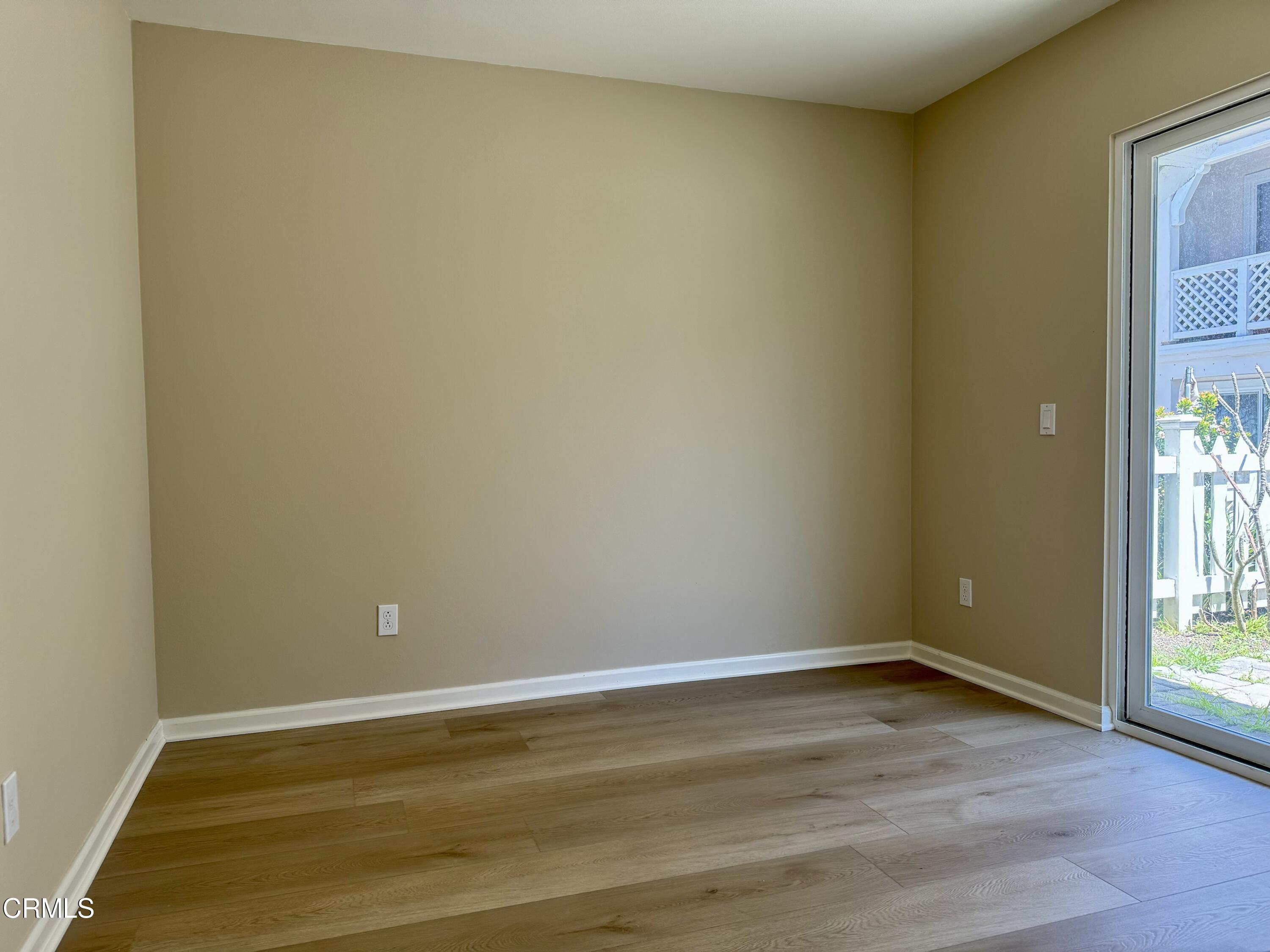 3667 Islander Walk Oxnard, CA 93035 - Photo 29 of 33 a view of an empty room with wooden floor and a window
