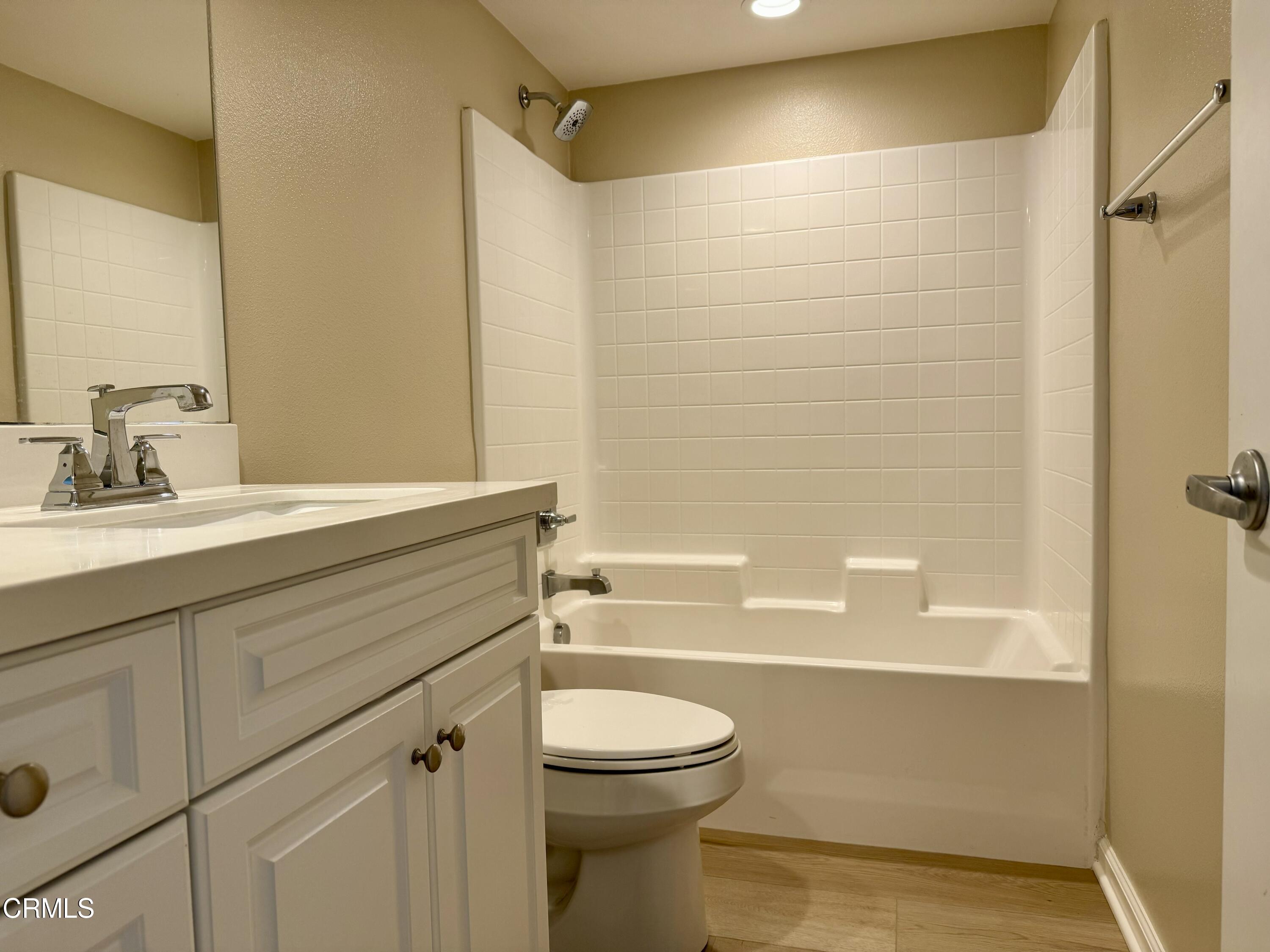 3667 Islander Walk Oxnard, CA 93035 - Photo 31 of 33 a bathroom with a sink a toilet and shower