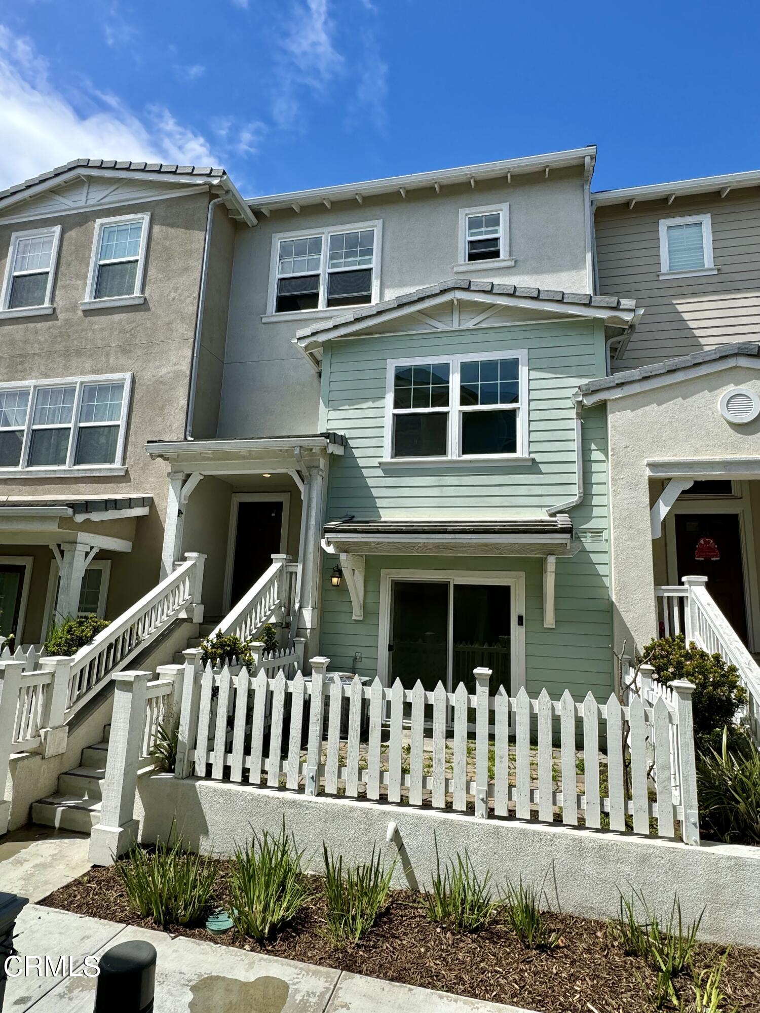 3667 Islander Walk Oxnard, CA 93035 - Photo 33 of 33 a front view of a house with a yard