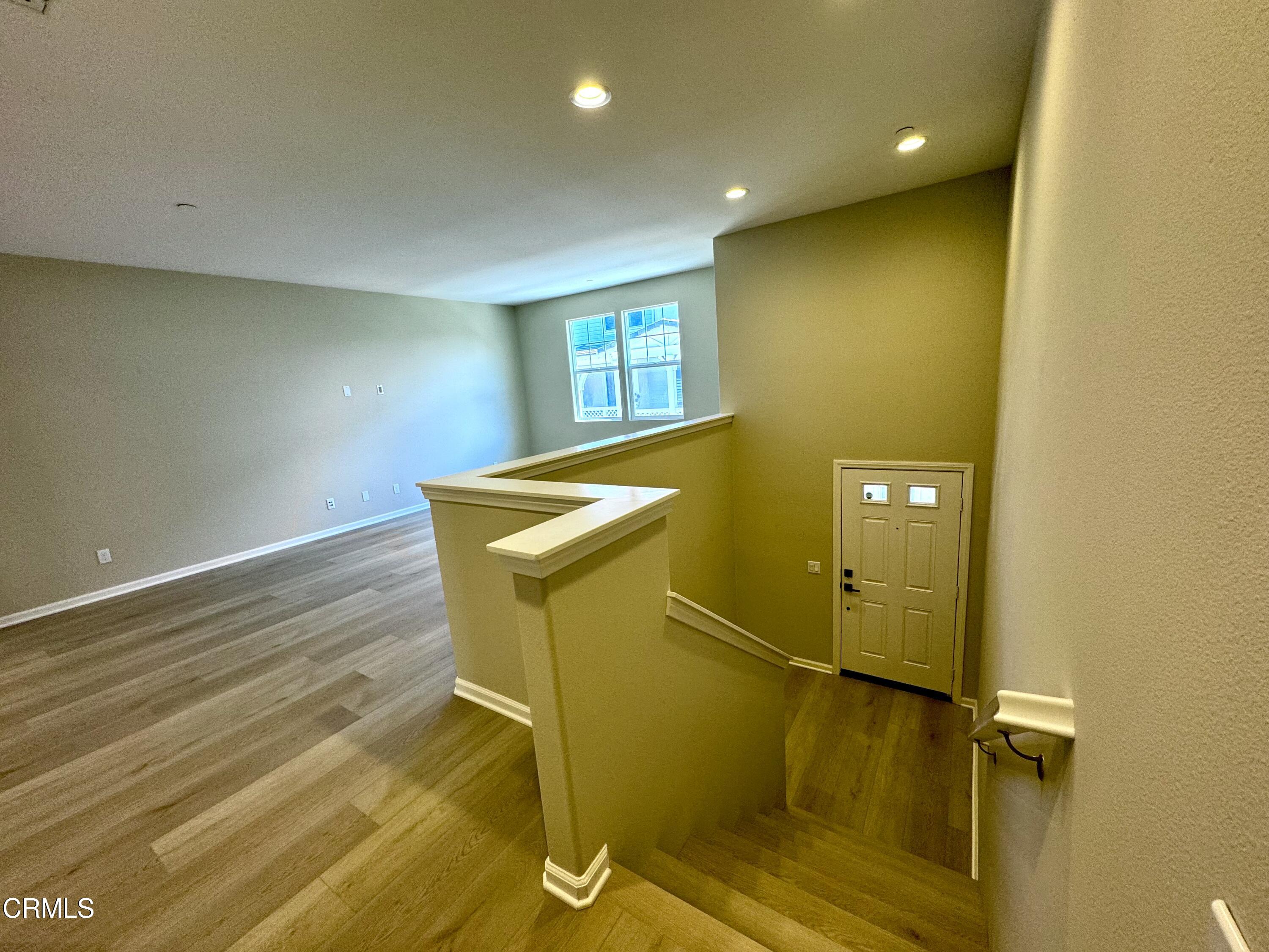 3667 Islander Walk Oxnard, CA 93035 - Photo 5 of 33 a view of a livingroom with wooden floor