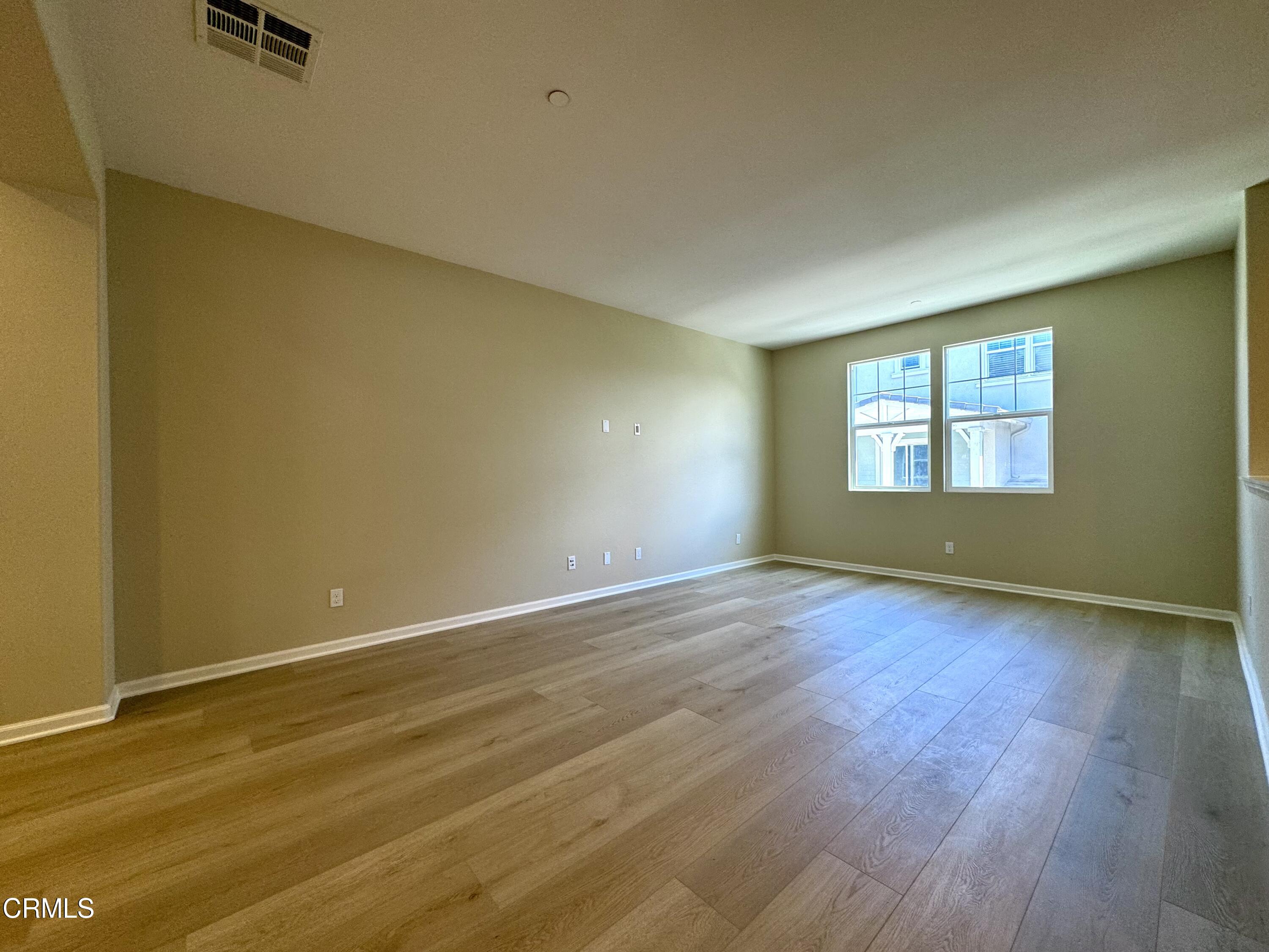 3667 Islander Walk Oxnard, CA 93035 - Photo 6 of 33 a view of empty room with wooden floor and fan