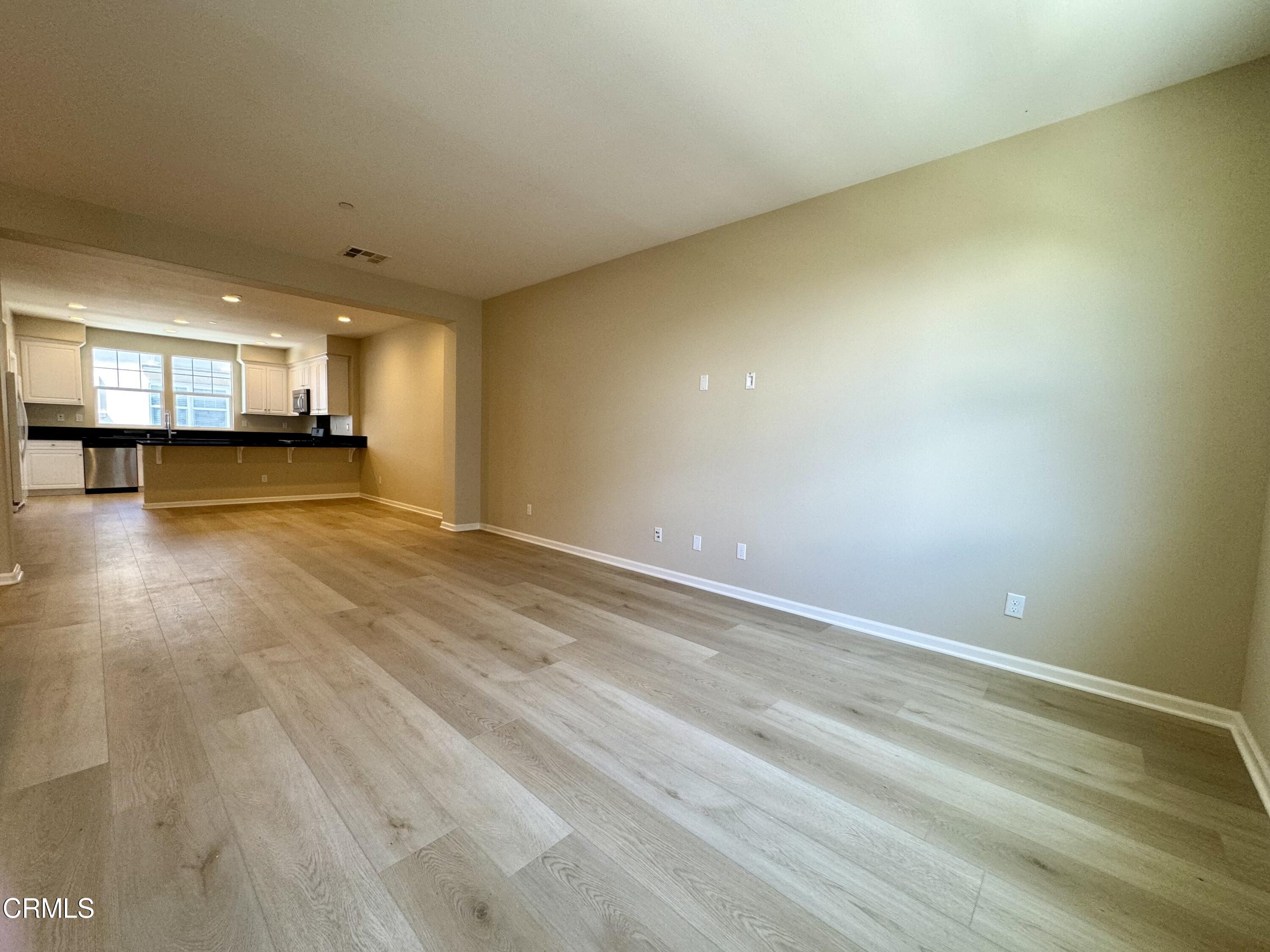 3667 Islander Walk Oxnard, CA 93035 - Photo 8 of 33 a view of a livingroom with wooden floor
