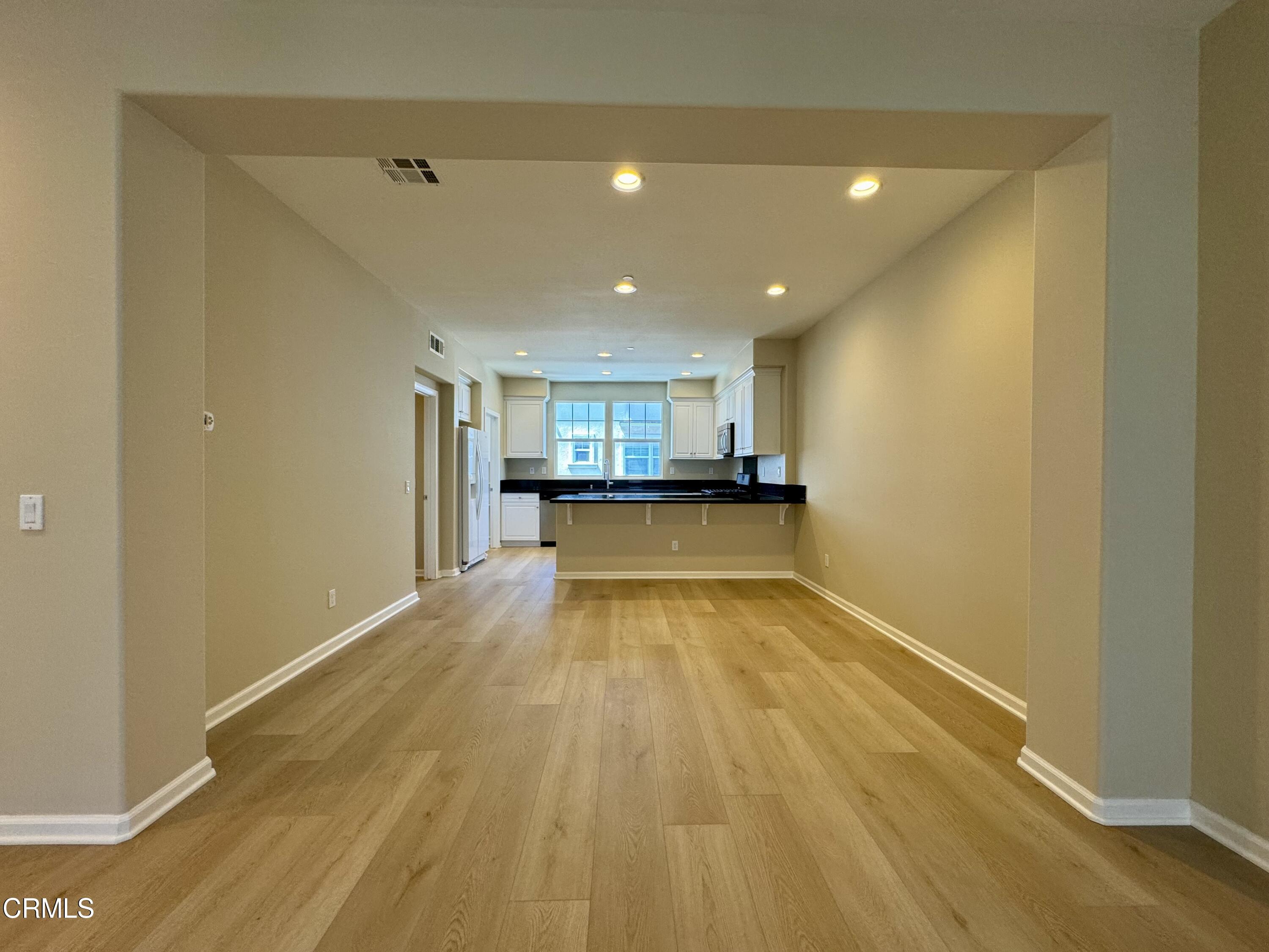 3667 Islander Walk Oxnard, CA 93035 - Photo 9 of 33 a view of a kitchen with a sink and a refrigerator
