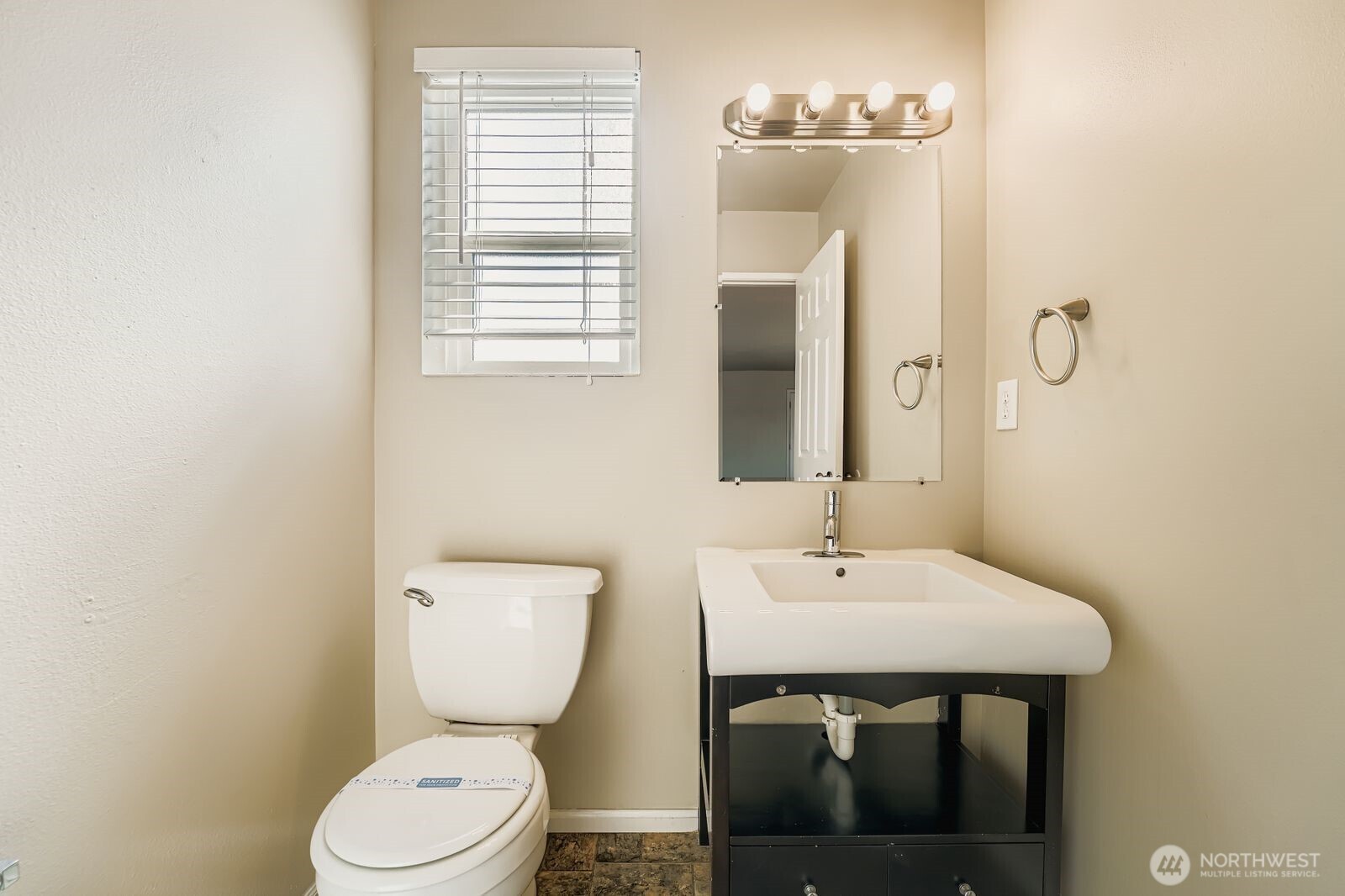 3727 South Pilgrim Street Seattle, WA 98118 - Photo 9 of 21 a bathroom with a toilet a sink and mirror