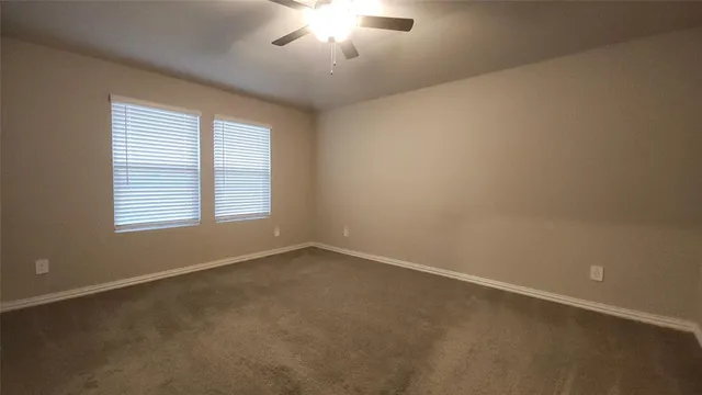 an empty room with closet area