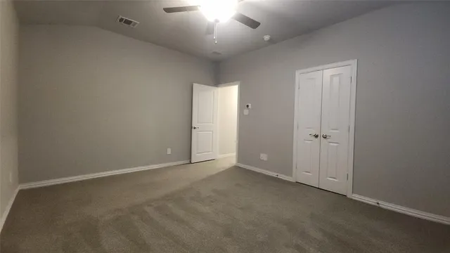 a spacious bathroom with a double vanity sink and mirror