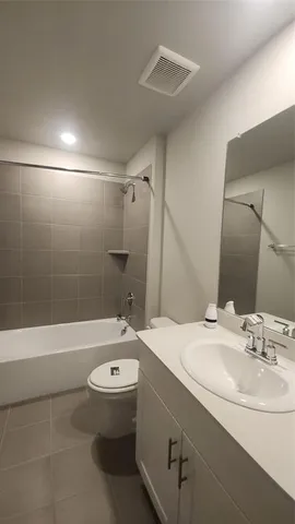 a bathroom with a sink a mirror and vanity