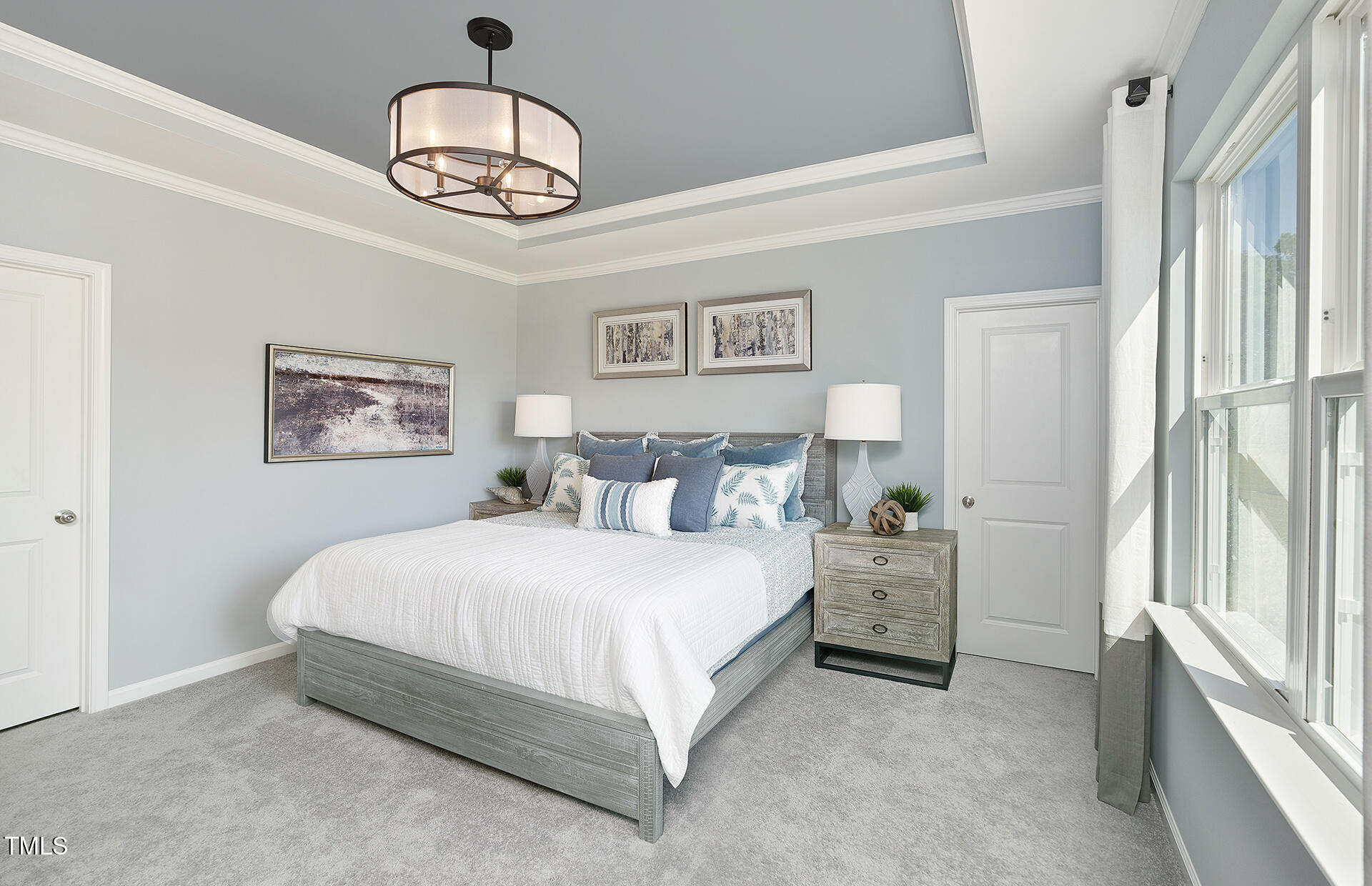 785 Denburn Place Raleigh, NC 27603 - Photo 5 of 14 a spacious bedroom with a bed and a chandelier