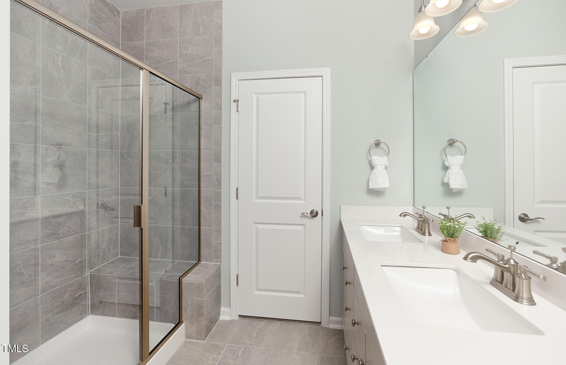 785 Denburn Place Raleigh, NC 27603 - Photo 6 of 14 a bathroom with a tub sink and mirror