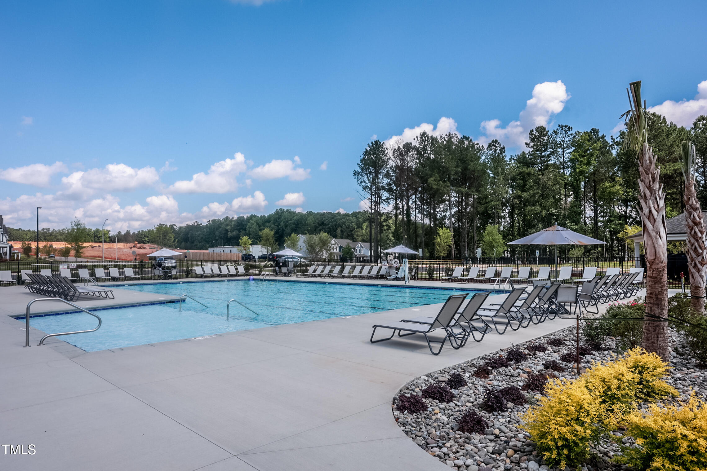 785 Denburn Place Raleigh, NC 27603 - Photo 10 of 14 a view of a lake with a city skyline in the background