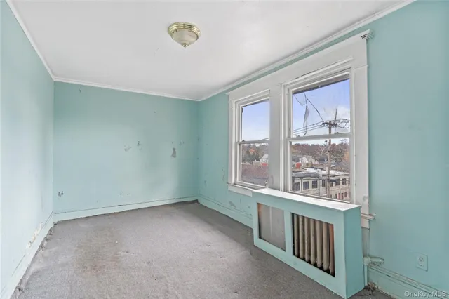 a white bath tub sitting next to a white sink and a toilet