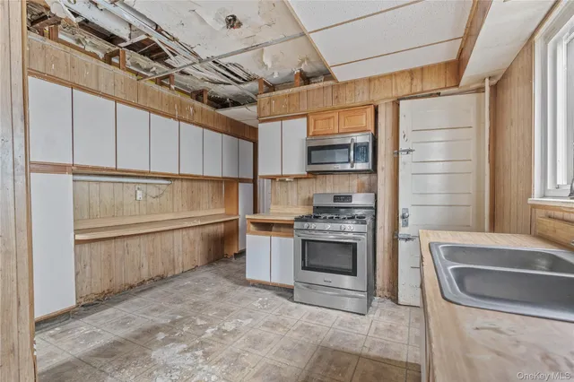 a kitchen with a stove and a refrigerator
