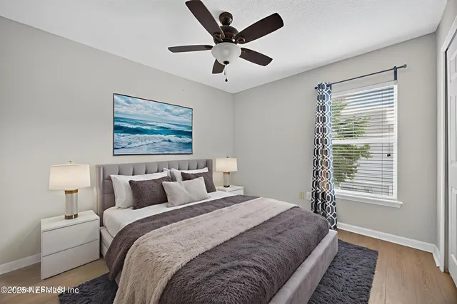 a bedroom with bed and window