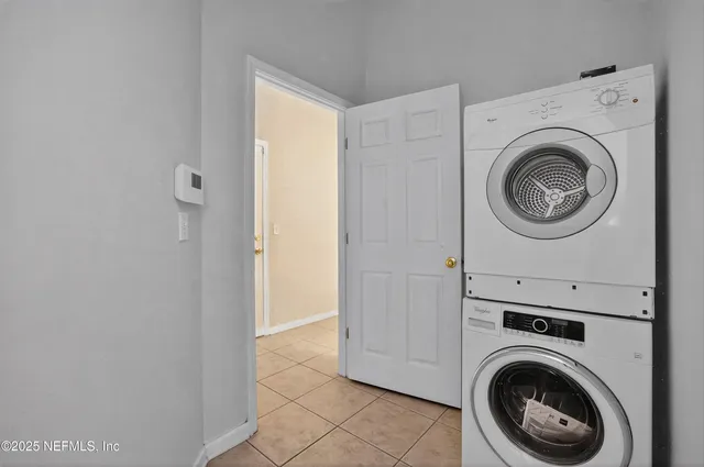 a view of a storage & utility room with dryer and washer