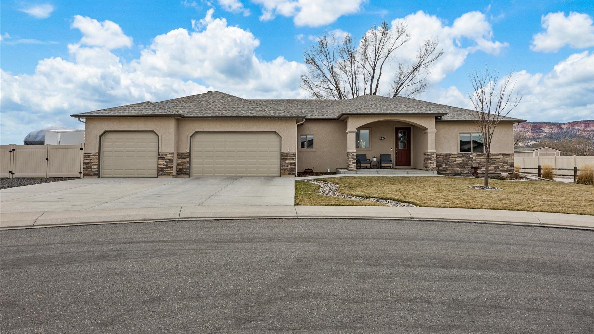 686 Beech Avenue Fruita, CO 81521 - Photo 1 of 33 a front view of a house with a yard