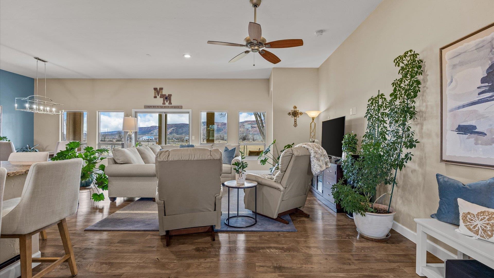 686 Beech Avenue Fruita, CO 81521 - Photo 11 of 33 a living room with furniture potted plant and a window
