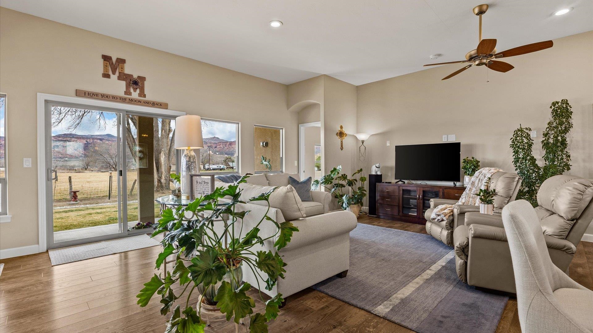 686 Beech Avenue Fruita, CO 81521 - Photo 12 of 33 a living room with furniture and a flat screen tv