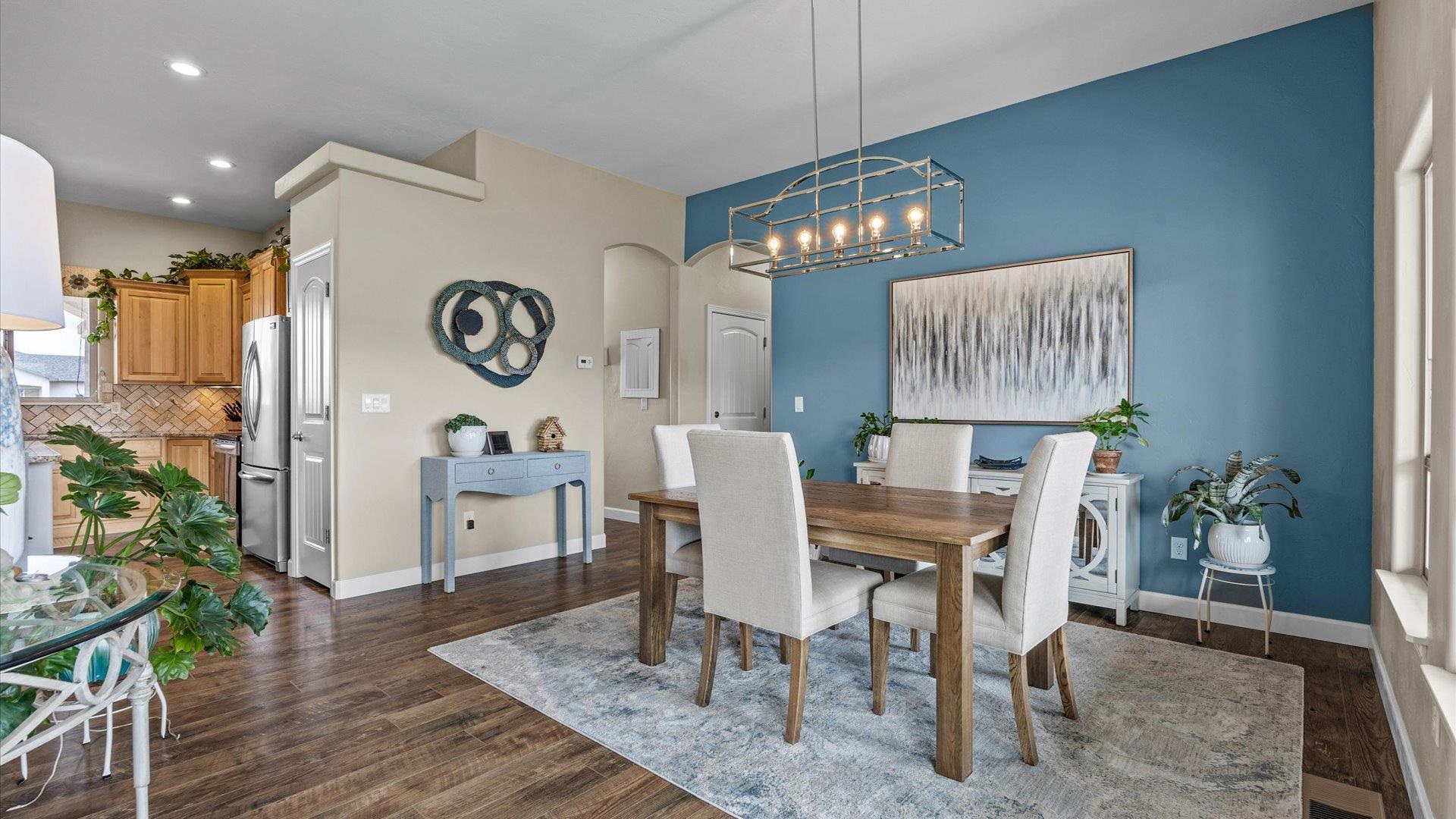 686 Beech Avenue Fruita, CO 81521 - Photo 16 of 33 a view of a dining room with furniture window and wooden floor