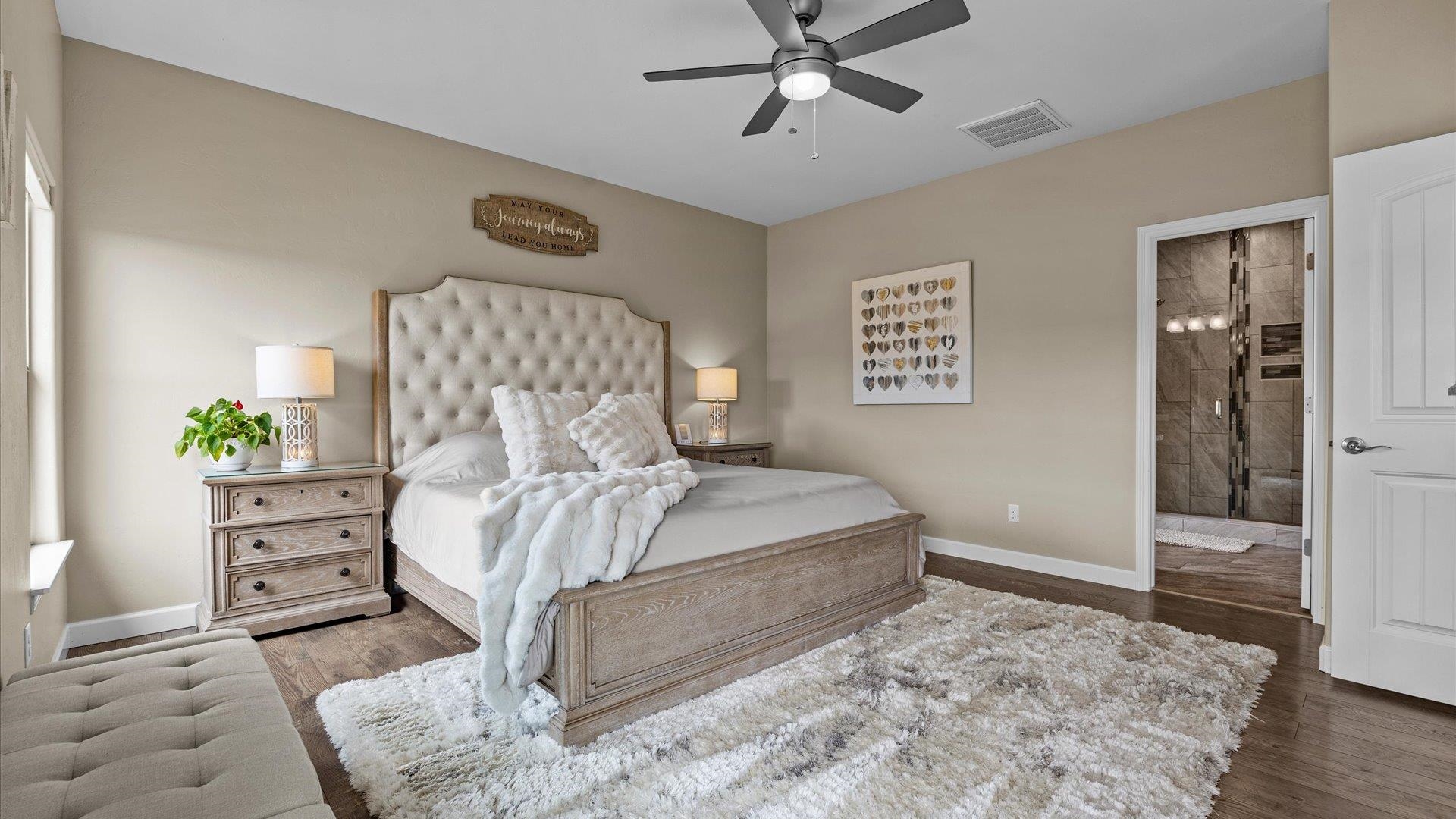 686 Beech Avenue Fruita, CO 81521 - Photo 18 of 33 a bedroom with a bed and a chandelier