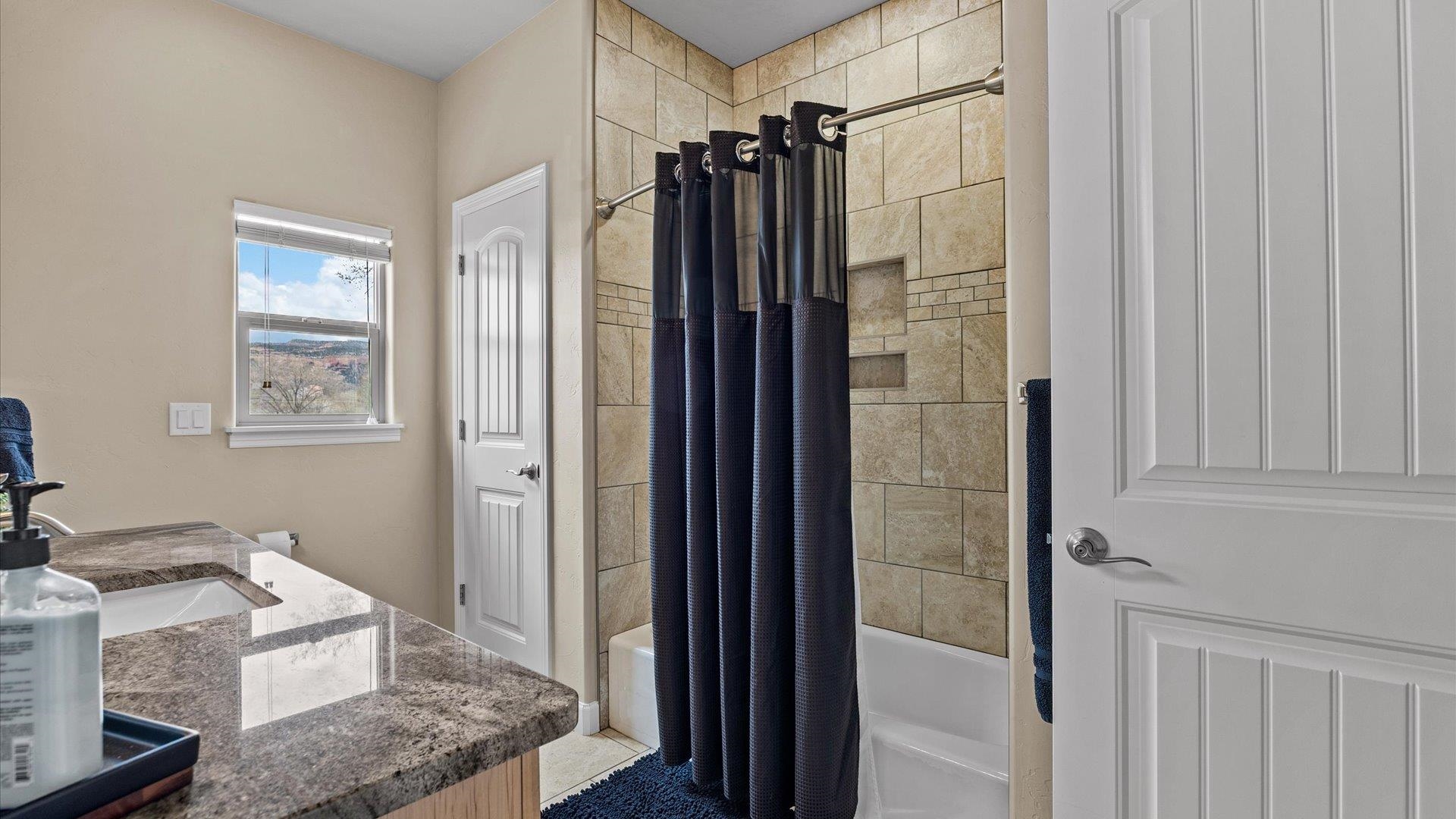 686 Beech Avenue Fruita, CO 81521 - Photo 24 of 33 a bathroom with a shower and a sink